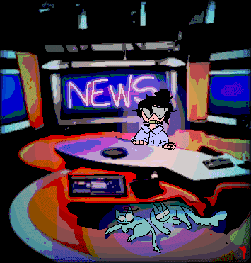 The NewsMan, sitting at his desk. Two cats appear under it, one stretching its legs and the other peeking through a purple cloth.